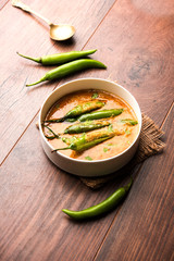 Hyderabadi mirch/mirchi ka Salan or green chilly sabzi or curry. Main course recipe from India. served in a bowl. selective focus