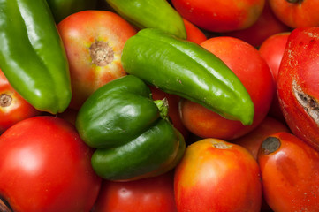 CLoseup of organic peppers and tomatoes stack
