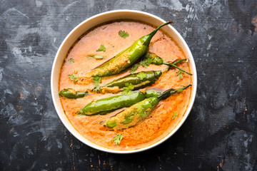 Hyderabadi mirch/mirchi ka Salan or green chilly sabzi or curry. Main course recipe from India. served in a bowl. selective focus