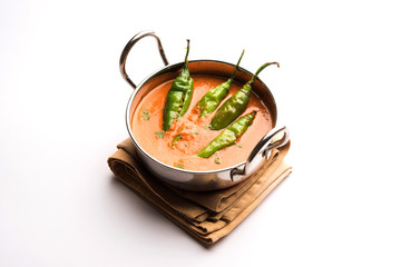 Hyderabadi mirch/mirchi ka Salan or green chilly sabzi or curry. Main course recipe from India. served in a bowl. selective focus