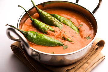 Hyderabadi mirch/mirchi ka Salan or green chilly sabzi or curry. Main course recipe from India. served in a bowl. selective focus