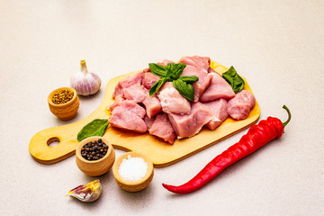 Raw pork neck, cut into pieces with fresh vegetables and dry spice