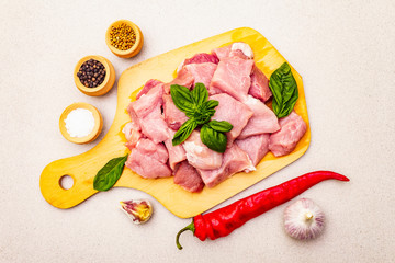 Raw pork neck, cut into pieces with fresh vegetables and dry spice