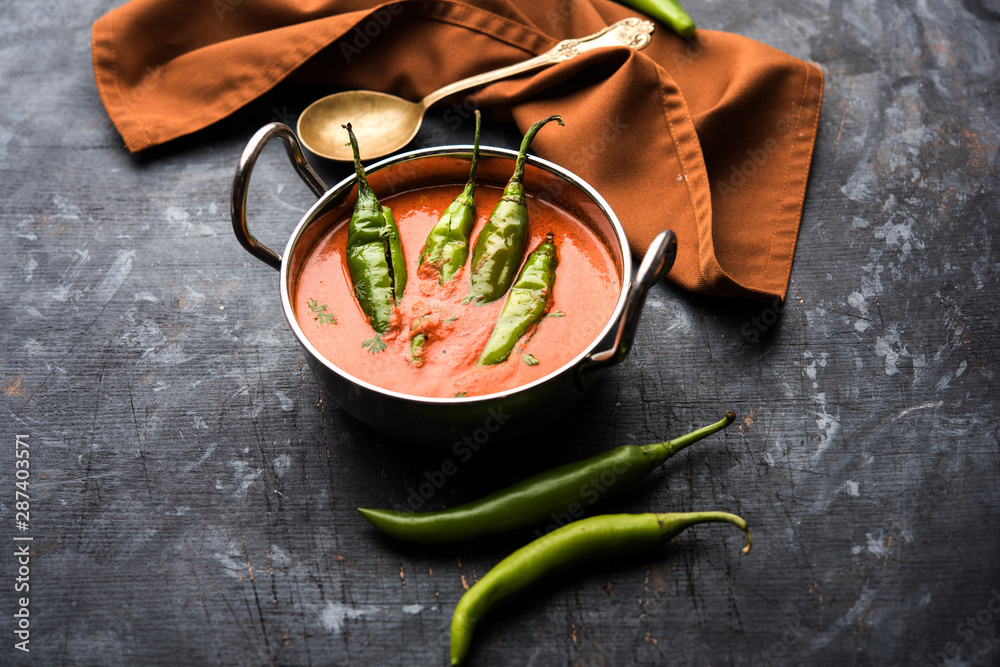 Wall mural Hyderabadi mirch/mirchi ka Salan or green chilly sabzi or curry. Main course recipe from India. served in a bowl. selective focus