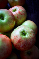 Fototapeta na wymiar Fresh country apples on the brown table