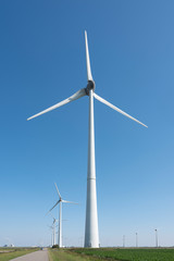 wind turbines and blue sky in the north of dutch province groningen near eemshaven
