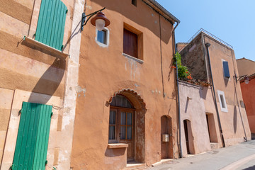 medieval ochre village of Roussillon in a sunny summer day Provence in France
