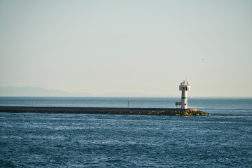 blue waves and lighthouse background