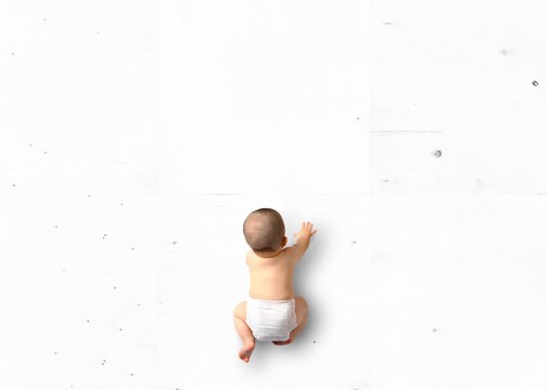 Cute baby crawling on the floor top view