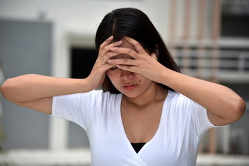 An Anxious Asian Adult Female