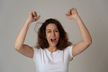 Surprised happy woman with red hair celebrating success victory or great sales