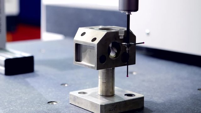 Close up automatic coordinate measurement machine (CMM) for inspection high precision part during working