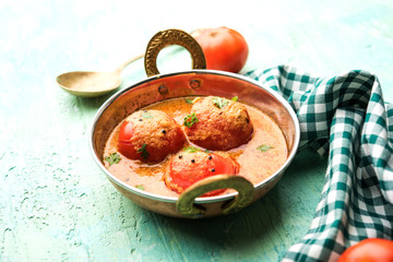 Tomato Salan or Tamatar sabzi or curry. Main course recipe from India. served in a bowl. selective focus