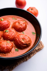 Tomato Salan or Tamatar sabzi or curry. Main course recipe from India. served in a bowl. selective focus