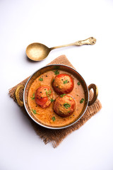 Tomato Salan or Tamatar sabzi or curry. Main course recipe from India. served in a bowl. selective...