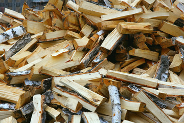 A pile of chopped birch firewood. Preparing for the heating season