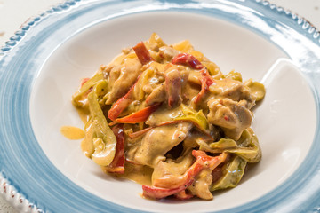 Butter Chicken Curry with Cream and Vegetables in Plate Ready to Serve