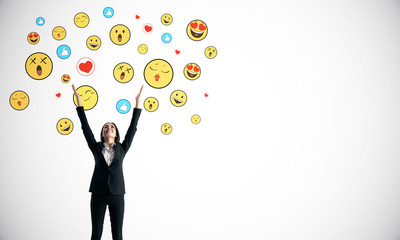 Portrait of happy businesswoman with smileys