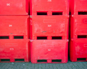 colorful plastic containers for fish or fish waste