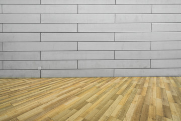 Empty wooden floors and cement walls are indoors