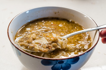 Homemade Curried Lentil Soup with Turkish Noodle Eriste in Spoon.