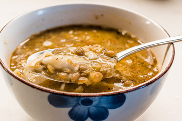 Homemade Curried Lentil Soup with Turkish Noodle Eriste in Spoon.