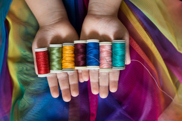 the colorful ropes on the hand on background.