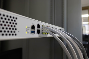 Network switch and ethernet cable connect to computer. - obrazy, fototapety, plakaty