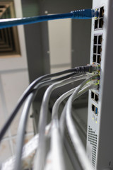 Network switch and ethernet cable connect to computer.