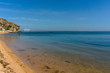 Sea waves. Sea of Crimea. High waves in clear weather. Sunny day at sea. Background blue sea waves. Sand beach. Clean beach.