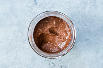 Homemade Organic Raw Nut Chocolate Cream in Jar.