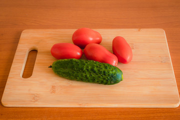 Tomatoes on a wooden Board