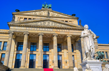 Obraz premium The Gendarmenmarkt square in Berlin, Germany which houses the Berlin Concert Hall (Konzerthaus) and the French and German Churches.