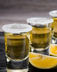 Tequila drink served in glasses with lime and salt