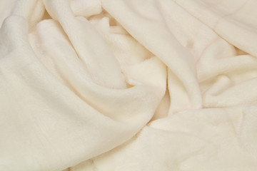 The blanket of furry fleece fabric. A background soft plush fleece material with a lot of relief...