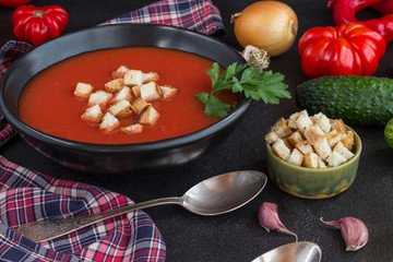Summer tomato soup, set of products for gazpacho, black background