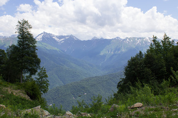 Fototapeta na wymiar View of the mountain range and lifts in the ski resort Rosa Khutor