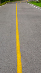 yellow line on the empty road - 287422523