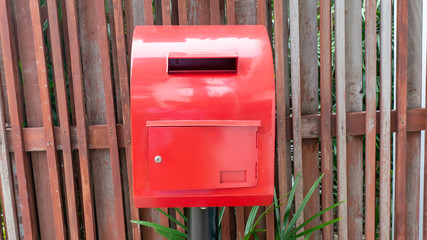 red mailbox on the wood fence - 287422568