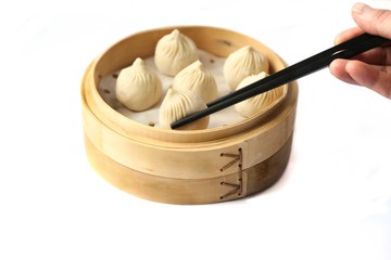 Dumplings in bamboo steamer