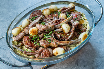 Lamb Chops with Shallots, Green Pea Hummus and Fresh Thyme Leaves served in Big Glass Tray Plate.