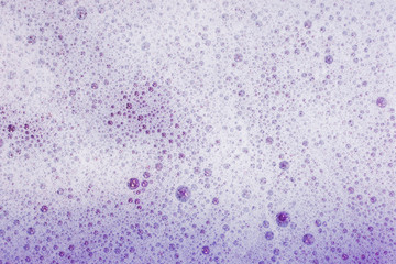 Soap bubbles background- suds liquid