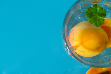 ripe apricots on the blue background