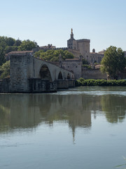France, july 2019: Saint Benezet bridge and Palace of the Popes in Avignon in a beautiful summer day