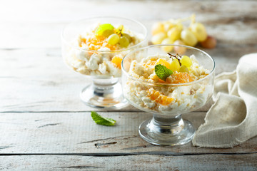 Homemade rice pudding with fresh orange