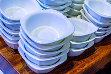 Kuala Lumpur, 1 September 2019 - Varieties of white tableware in the store. The concept of choosing dishes, sales, promotions.