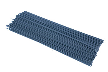 Background of black linguine Italian pasta isolated on white background with copy space.