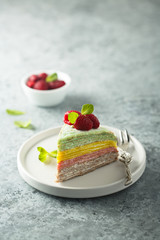 Homemade rainbow pancake cake with fresh raspberry