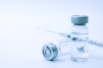 Vaccines, botulinum toxin and insulin ampules concept theme with glass vials with clear liquid next...