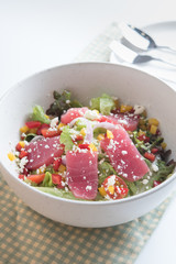 Rare seared ahi tuna slices with fresh vegetable
